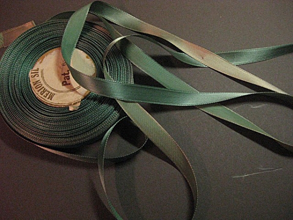 Faded teal ribbon
